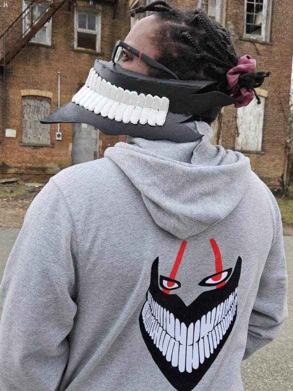 Okarun from DanDaDan Turbo Granny Form on a space gray hoodie.