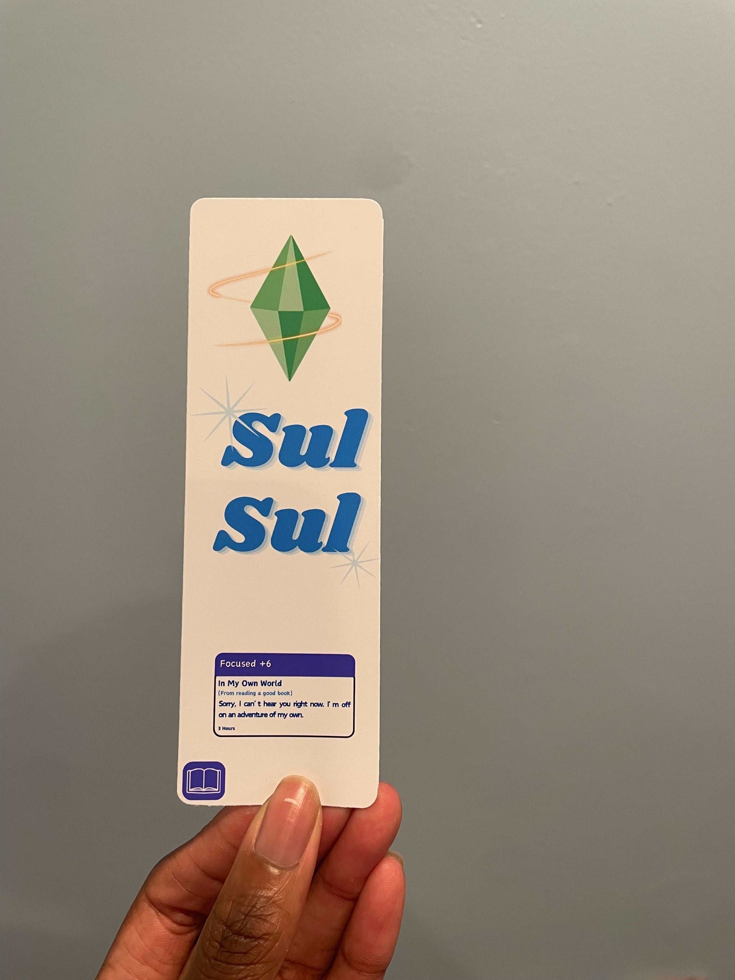 Sims 4 bookmark featuring the 'Sul Sul' greeting and a 'Focused' moodlet.