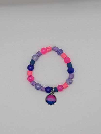 Colorful beaded bracelet with a bisexual pride charm on a white background