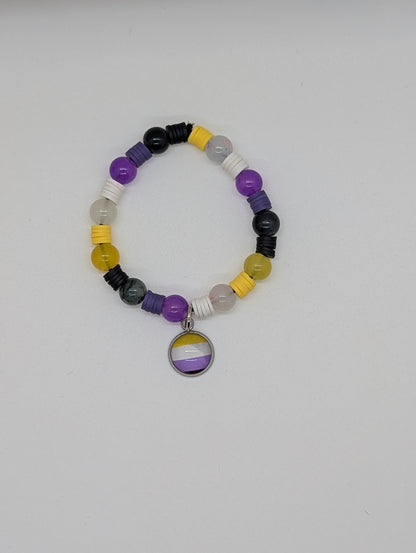 Beaded bracelet with a central pendant on a light gray background