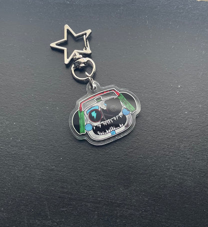 Keychain with cartoon character design on a black background