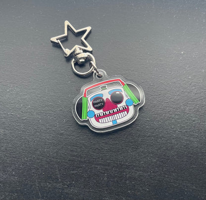Keychain with a colorful design on a dark surface