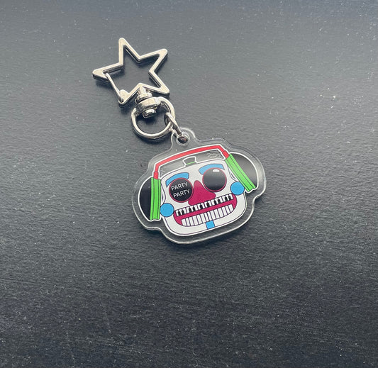 Keychain with a colorful design on a dark surface