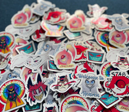 Collection of colorful stickers with various designs on a dark background