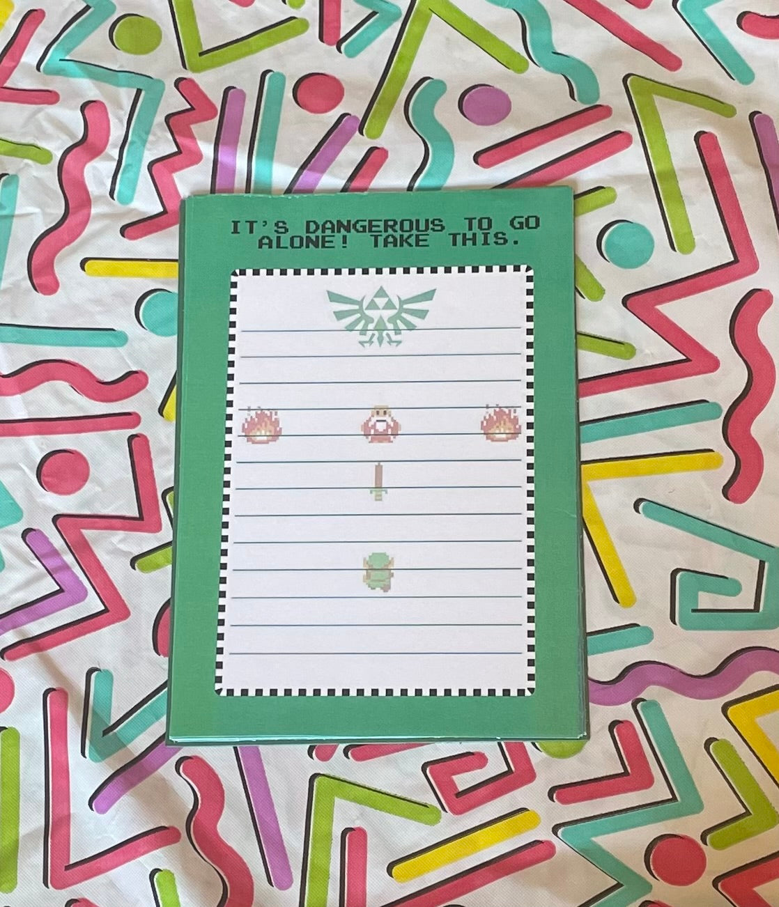 Notebook with themed cover on a colorful abstract background