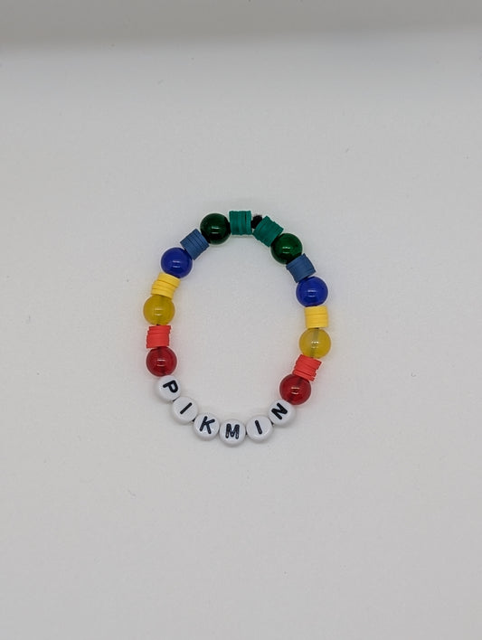 Colorful beaded bracelet with 'PIKMIN' letters on a white background