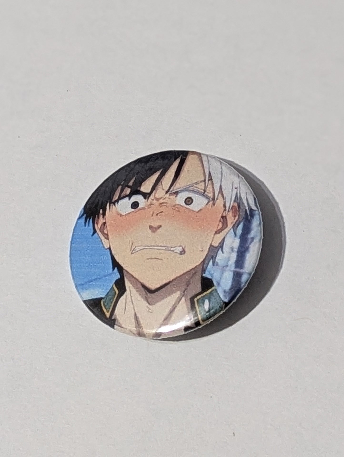 Circular badge with an anime character on a light gray background