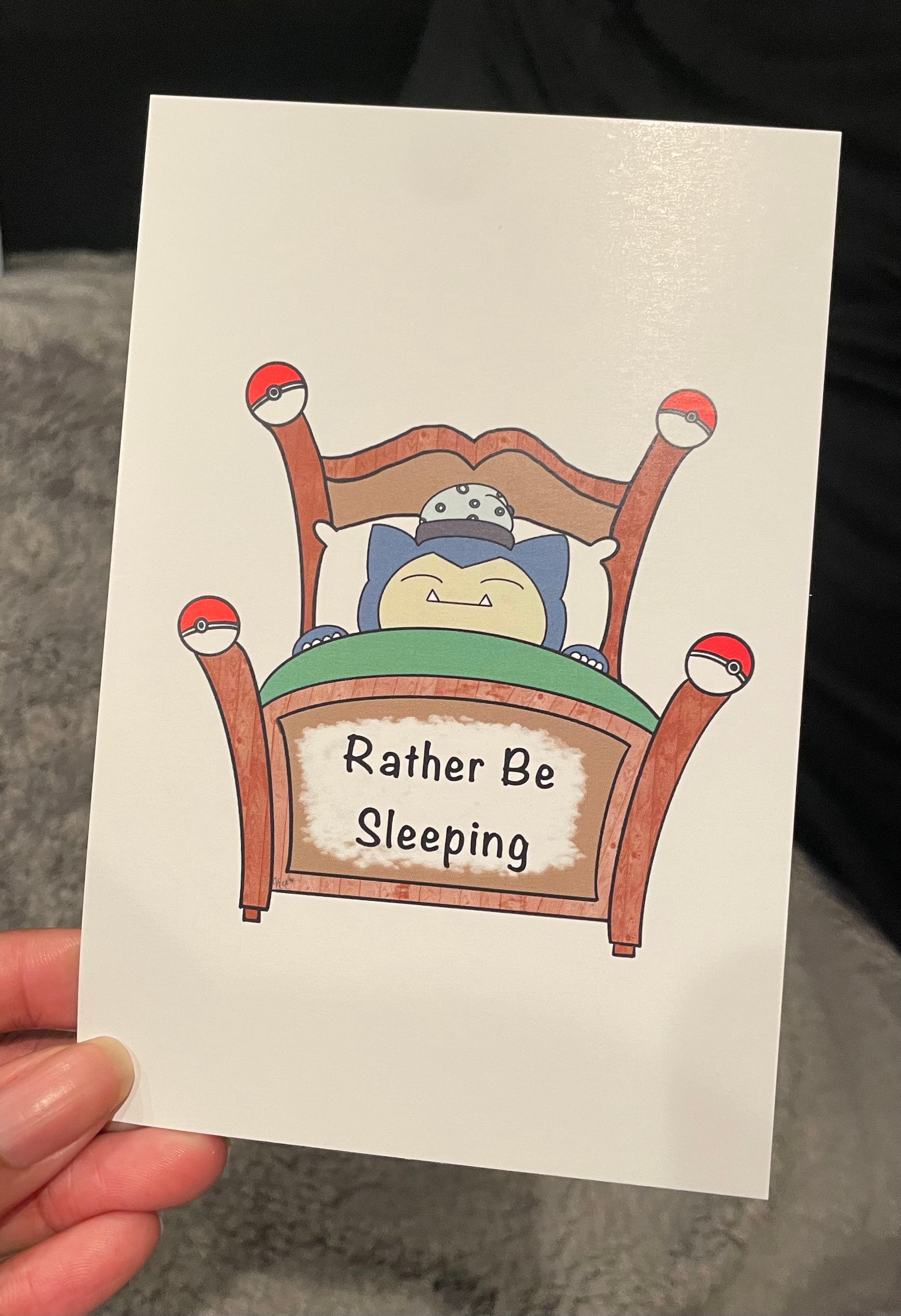 Card with a cartoon character sleeping in bed and 'Rather Be Sleeping' text.