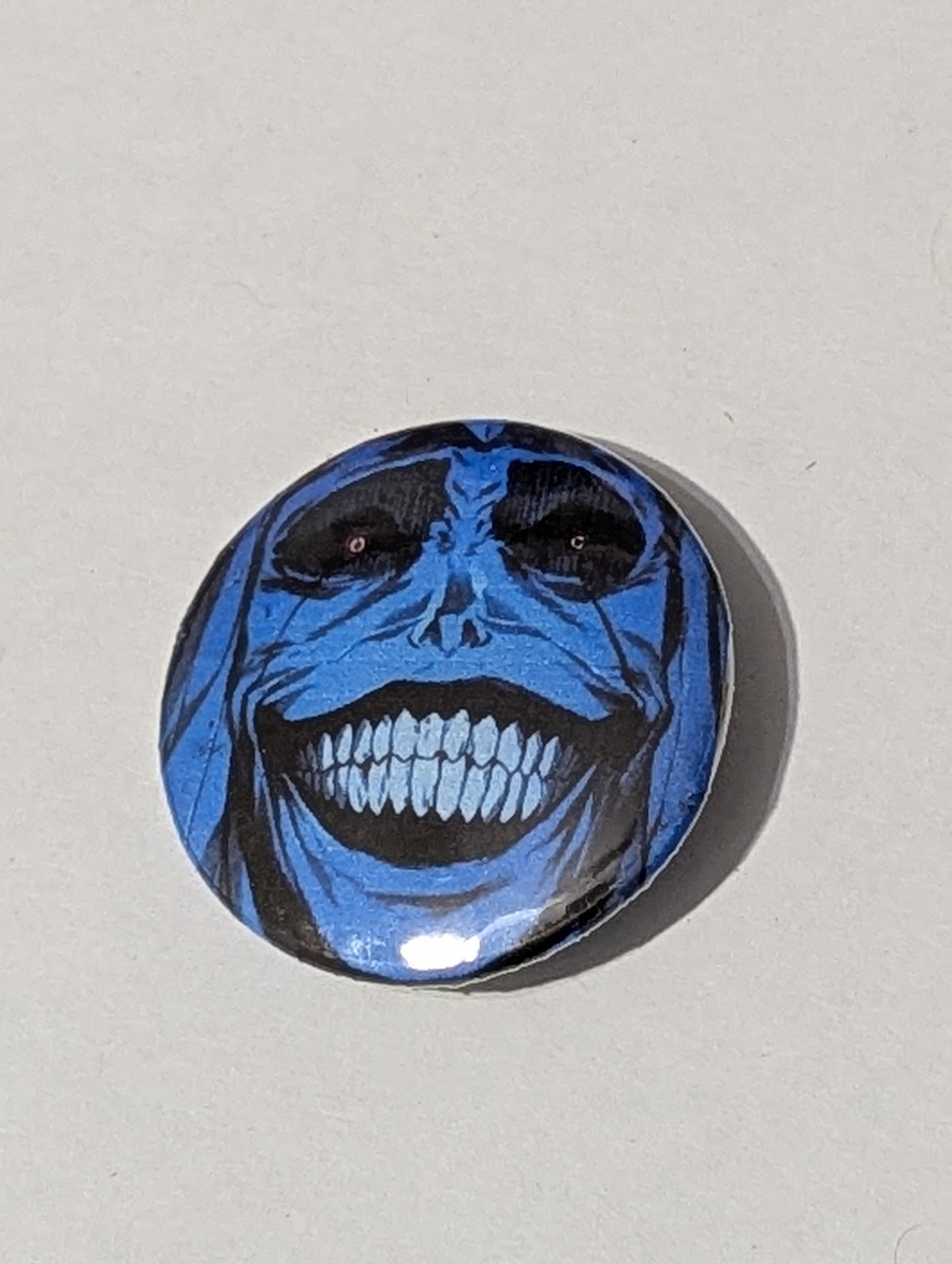 Circular blue and black design on a light gray background